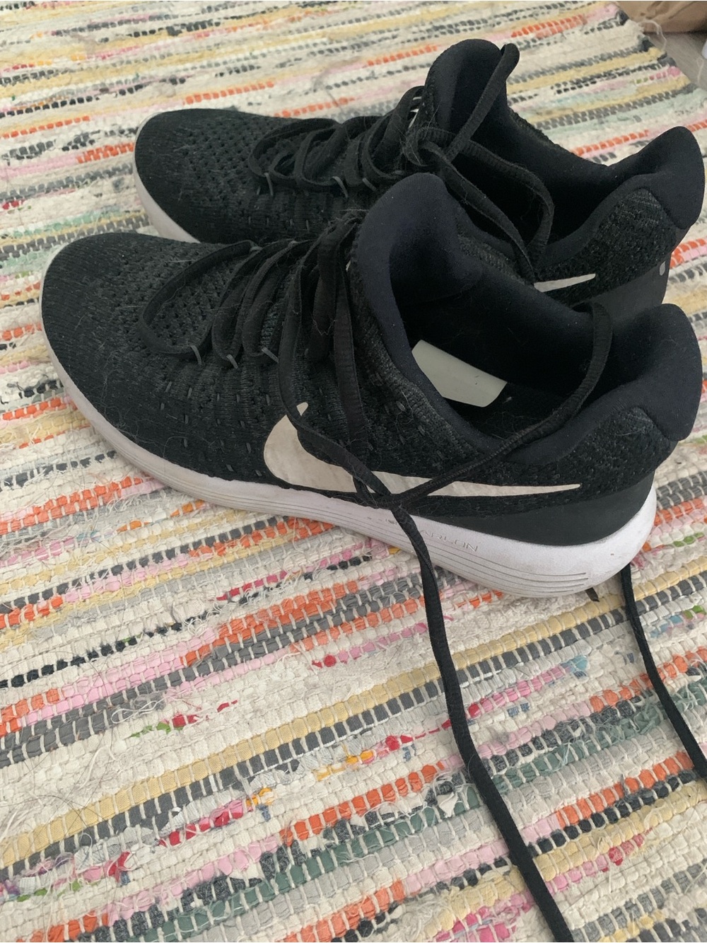 Nike Black Running Shoes with White Swoosh Accent